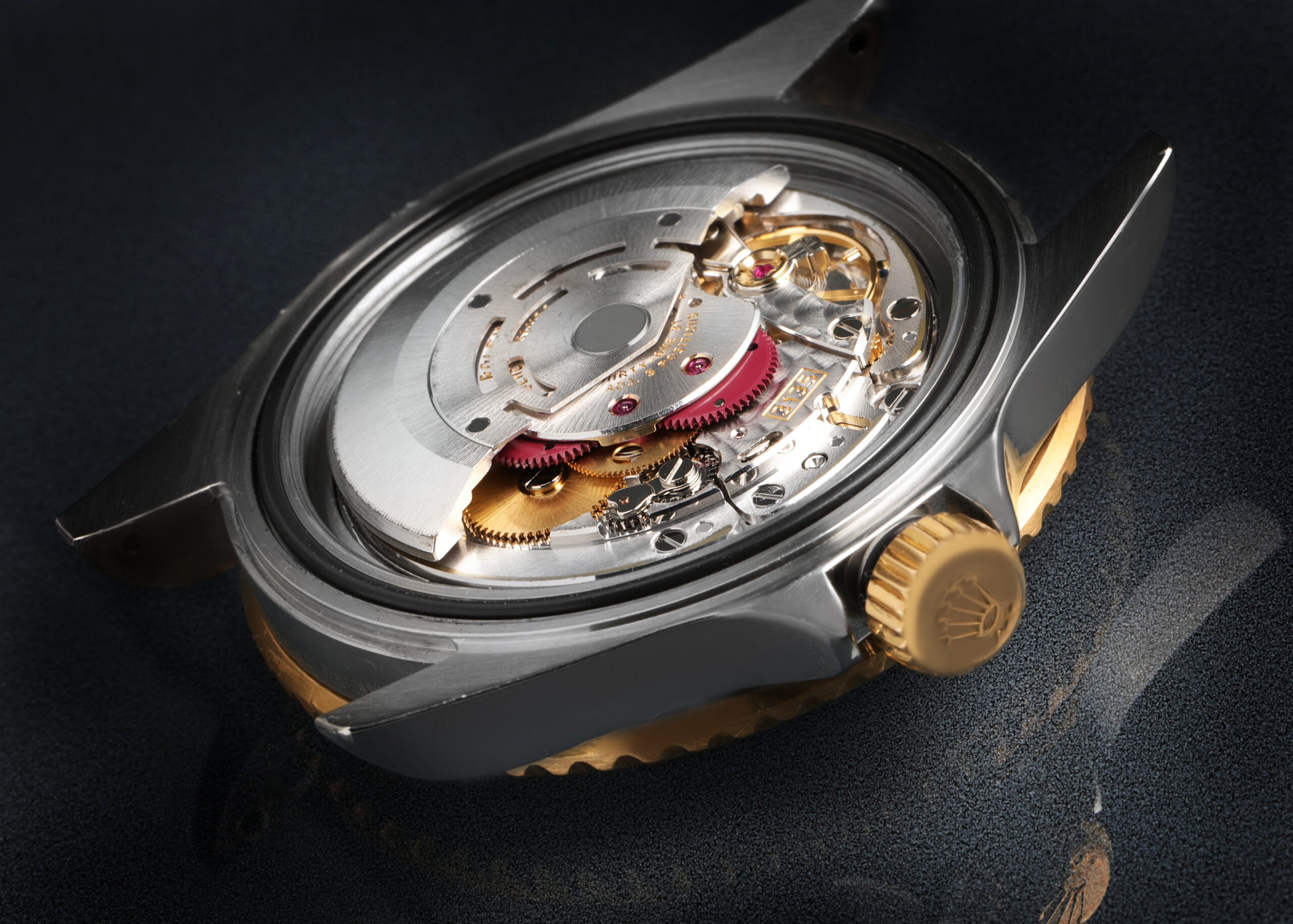 An open Rolex caseback revealing the intricate, highly finished genuine mechanical movement inside.