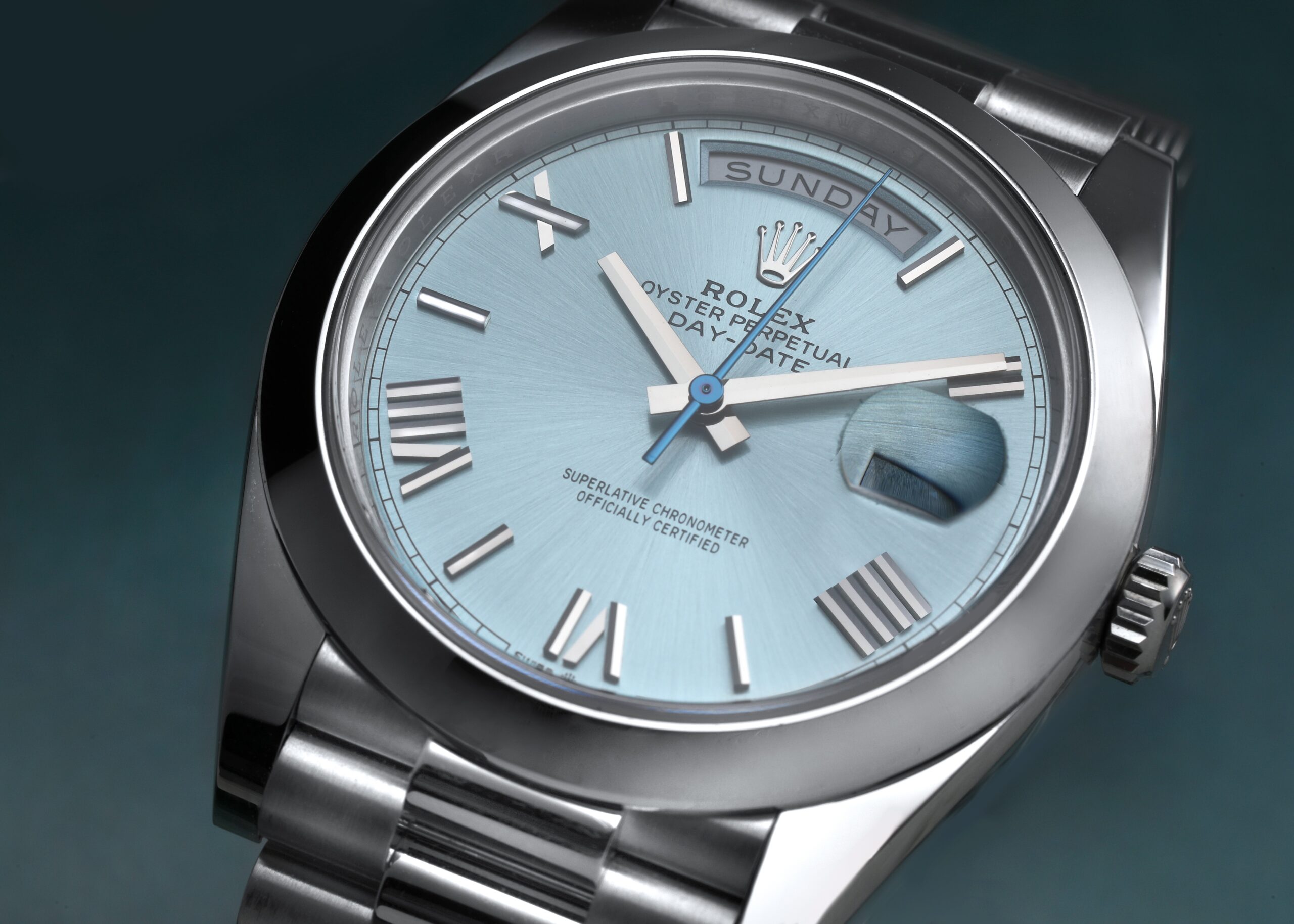 A detailed view of the Rolex Day-Date 40 in platinum (Ref. 228206) with its signature ice blue dial, a symbol of success worn by Lionel Messi.