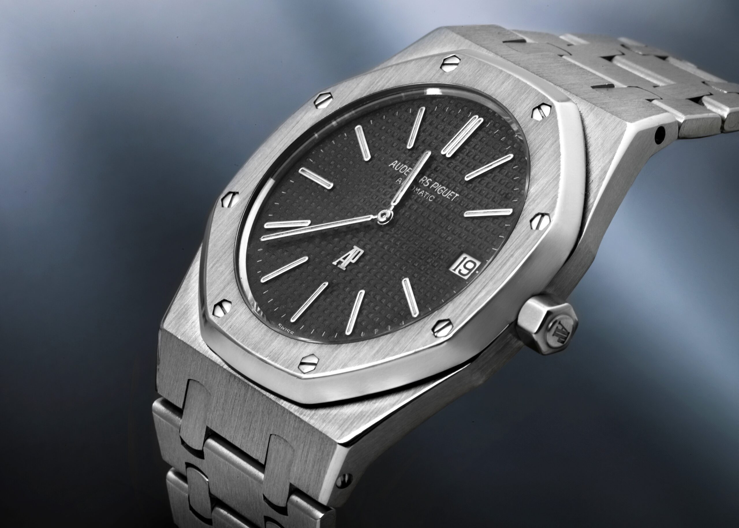 An Audemars Piguet Royal Oak 56175ST in stainless steel, highlighting its iconic octagonal bezel and black 'Tapisserie' dial.
