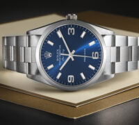 A Rolex Air-King 14000 with a blue 3-6-9 dial, representing one of the most affordable pre-owned Rolex watches for men.