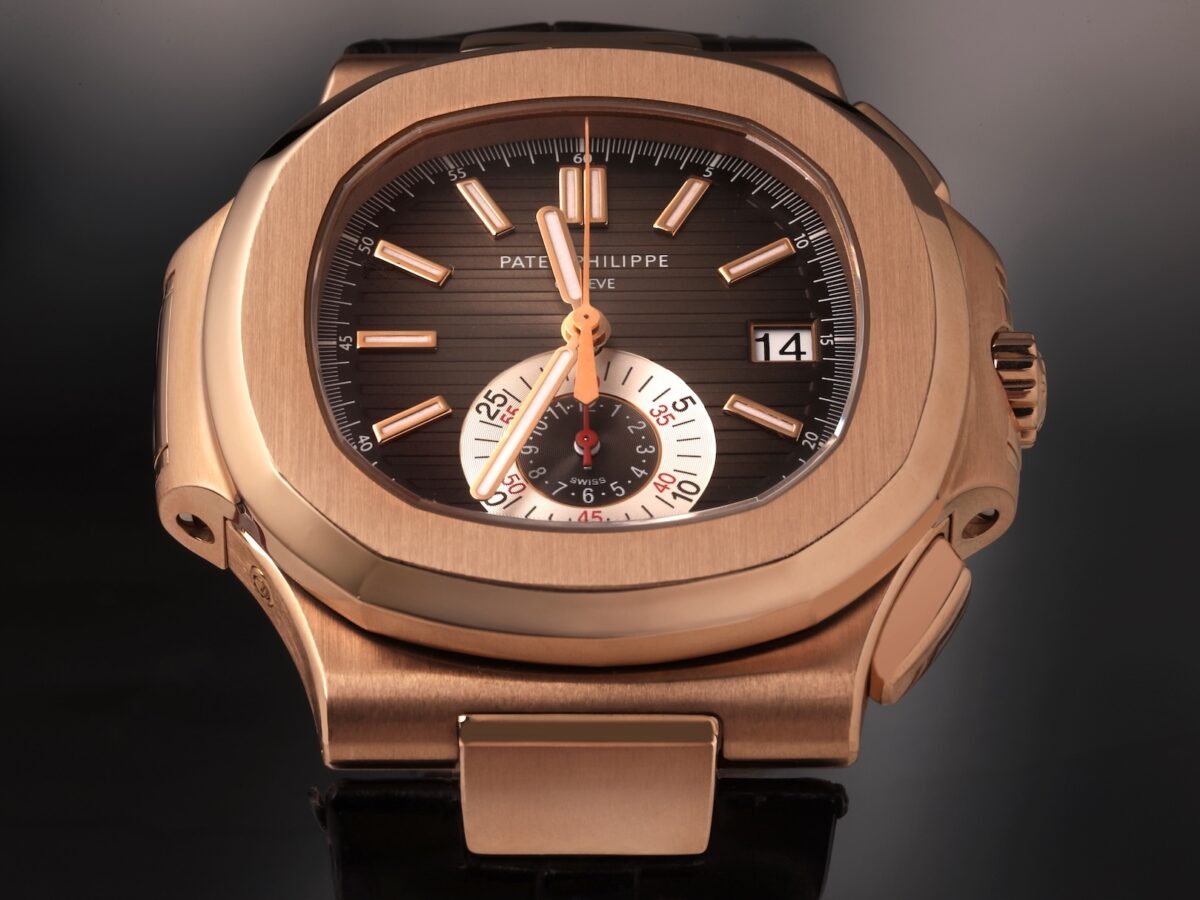 Close-up of the Patek Philippe Nautilus Chronograph Ref 5980R-001 in 18k rose gold, featuring the signature black-brown gradient dial and 6 oclock monocounter.