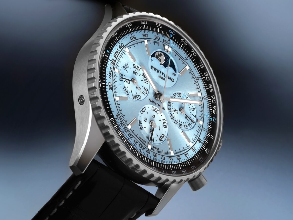 Macro profile view of the solid platinum Breitling Navitimer B19 perpetual calendar with ice blue dial.