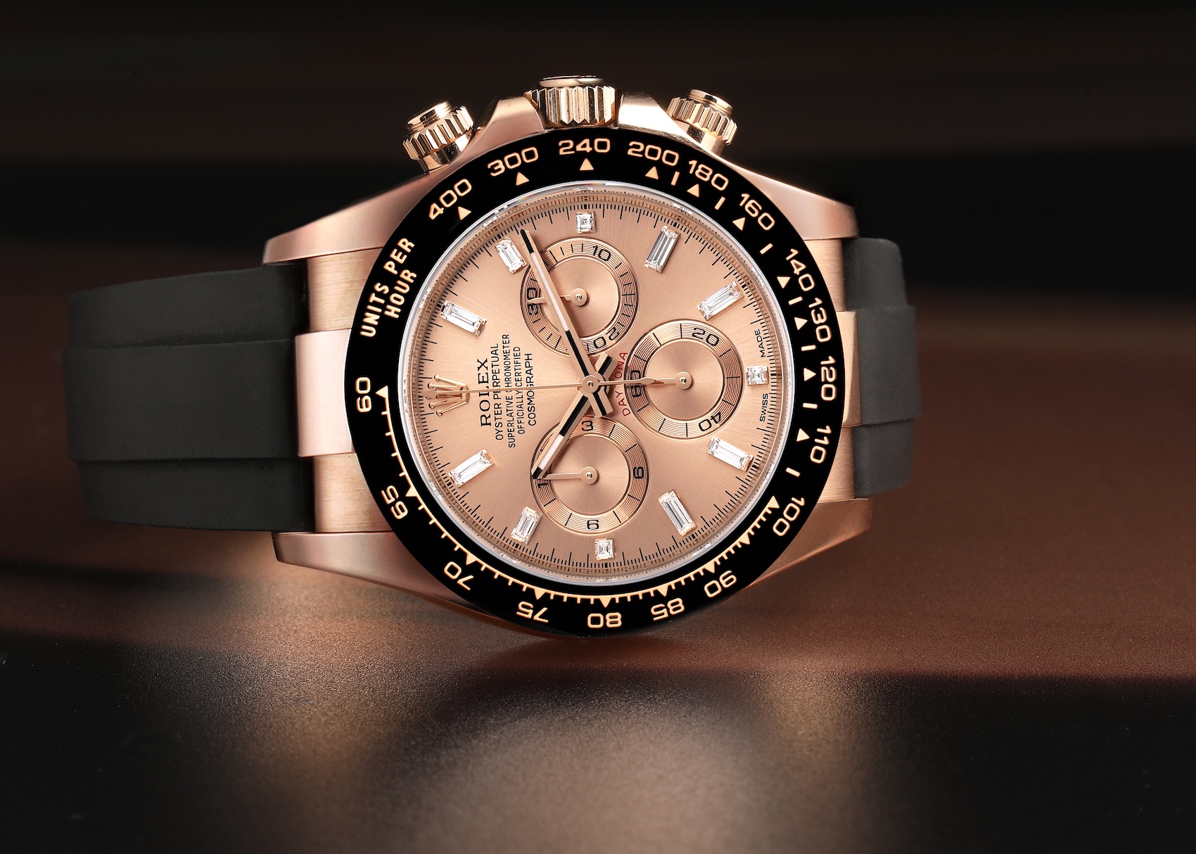Rolex Cosmograph Daytona Reference 116515LN in 18k Everose gold with a sundust diamond-set dial and black Oysterflex rubber strap.