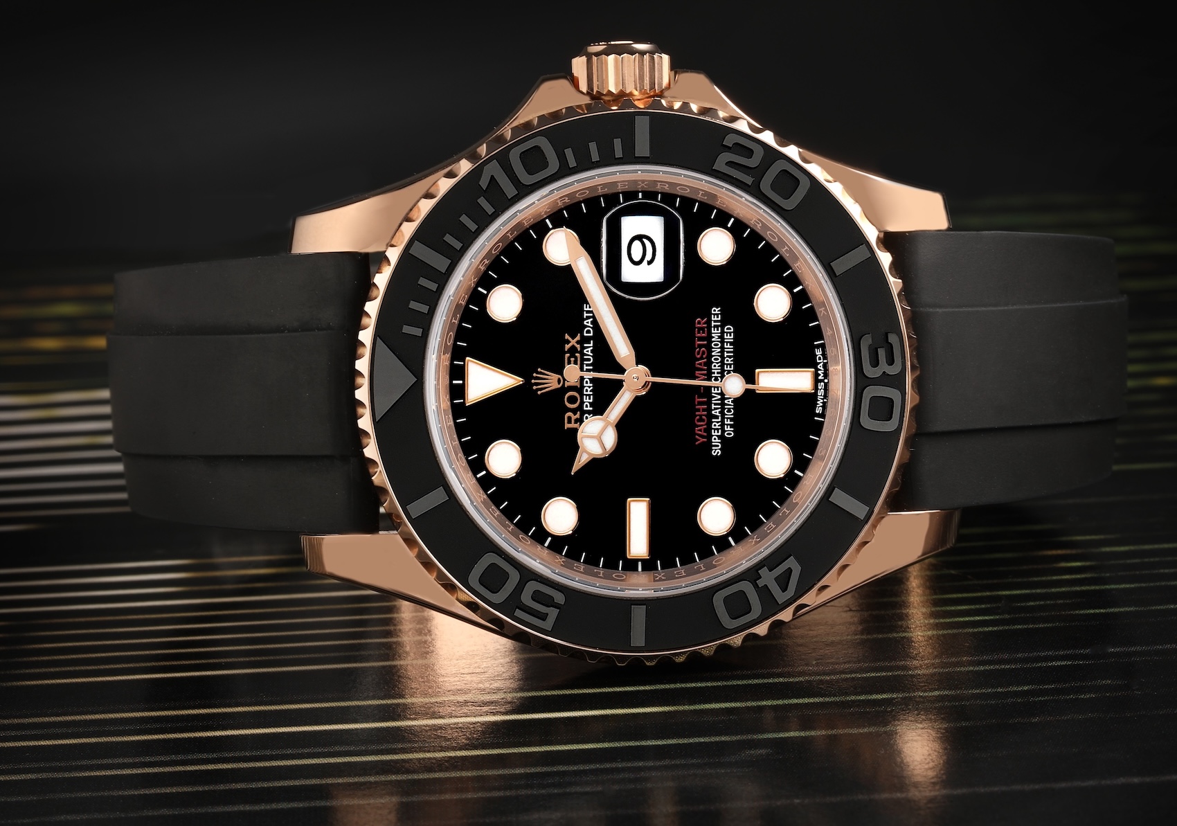 Rolex Yacht-Master 40 in Everose gold with a matte black Cerachrom bezel on a black Oysterflex bracelet, reference 126655.