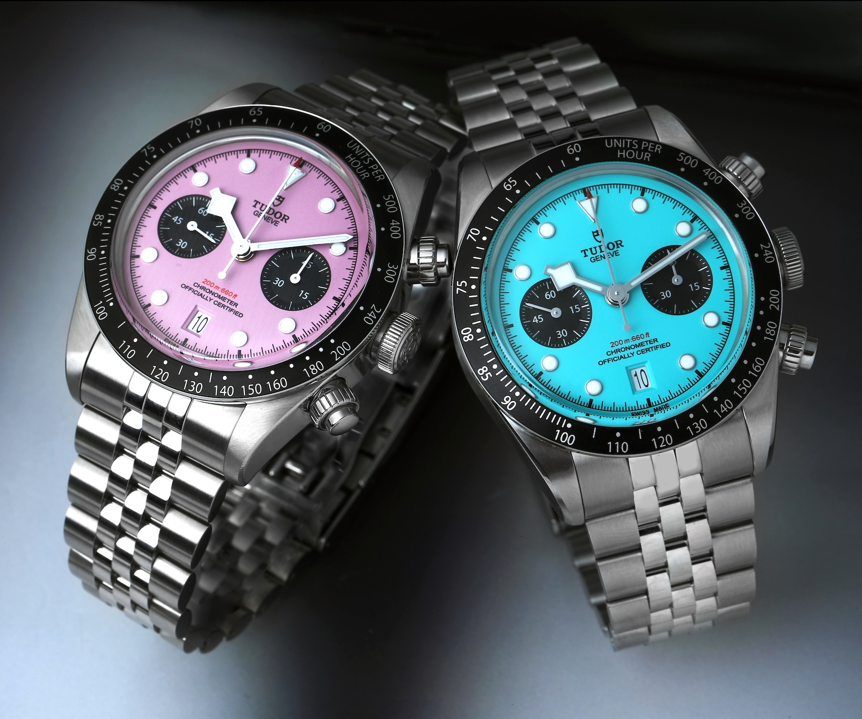 Tudor Black Bay Chrono Miami Pink and Flamingo Blue side by side on steel bracelets