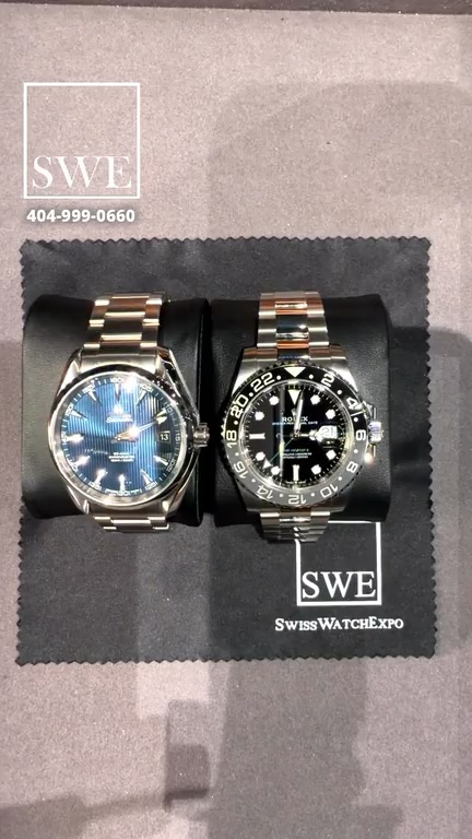 A side-by-side comparison of an Omega Aqua Terra and a Rolex GMT-Master II on black cushions during the live Grail Bracket broadcast.