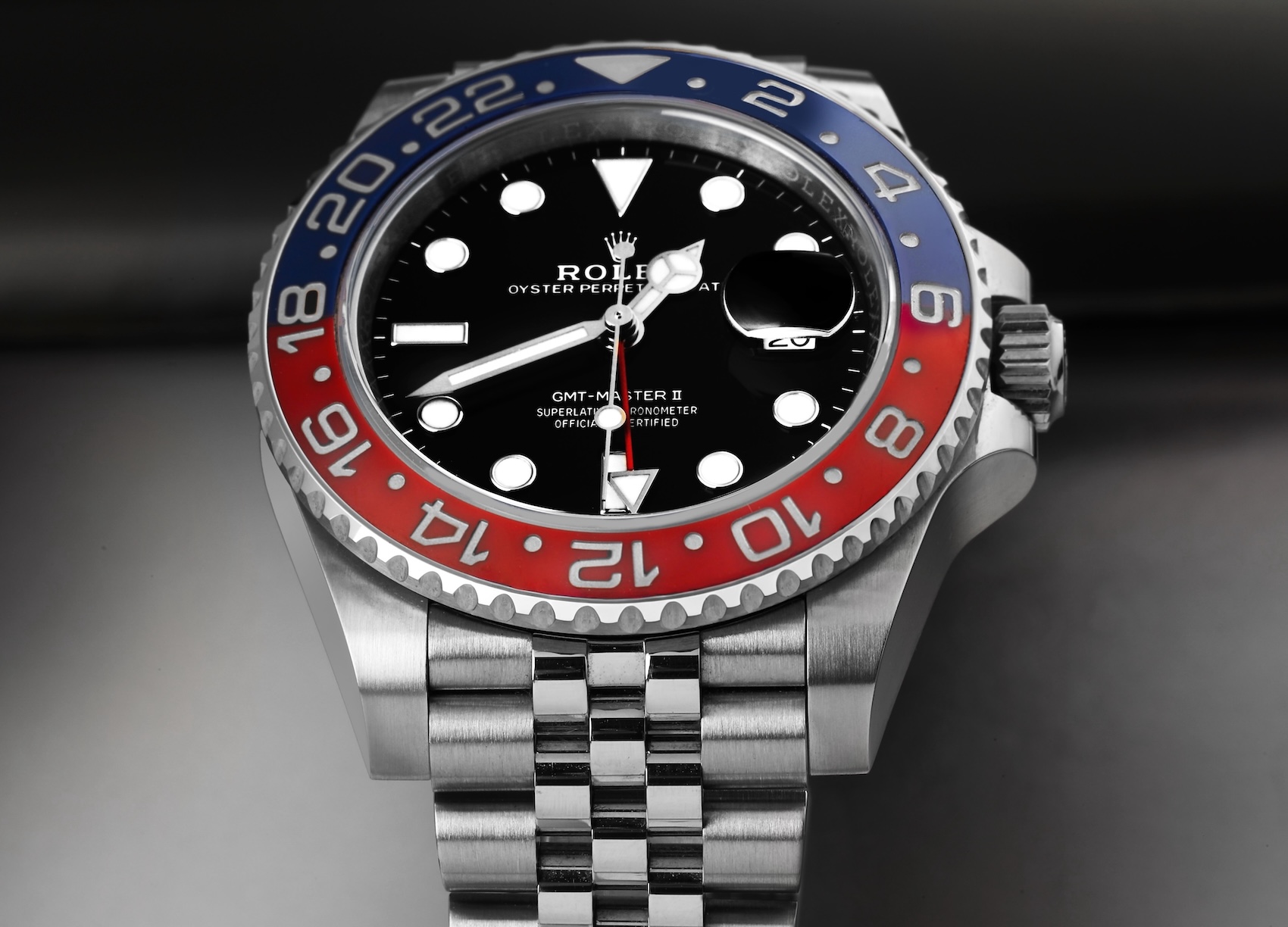 Close-up of the Rolex GMT-Master II reference 126710 with a red and blue Pepsi bezel on a steel Jubilee bracelet.