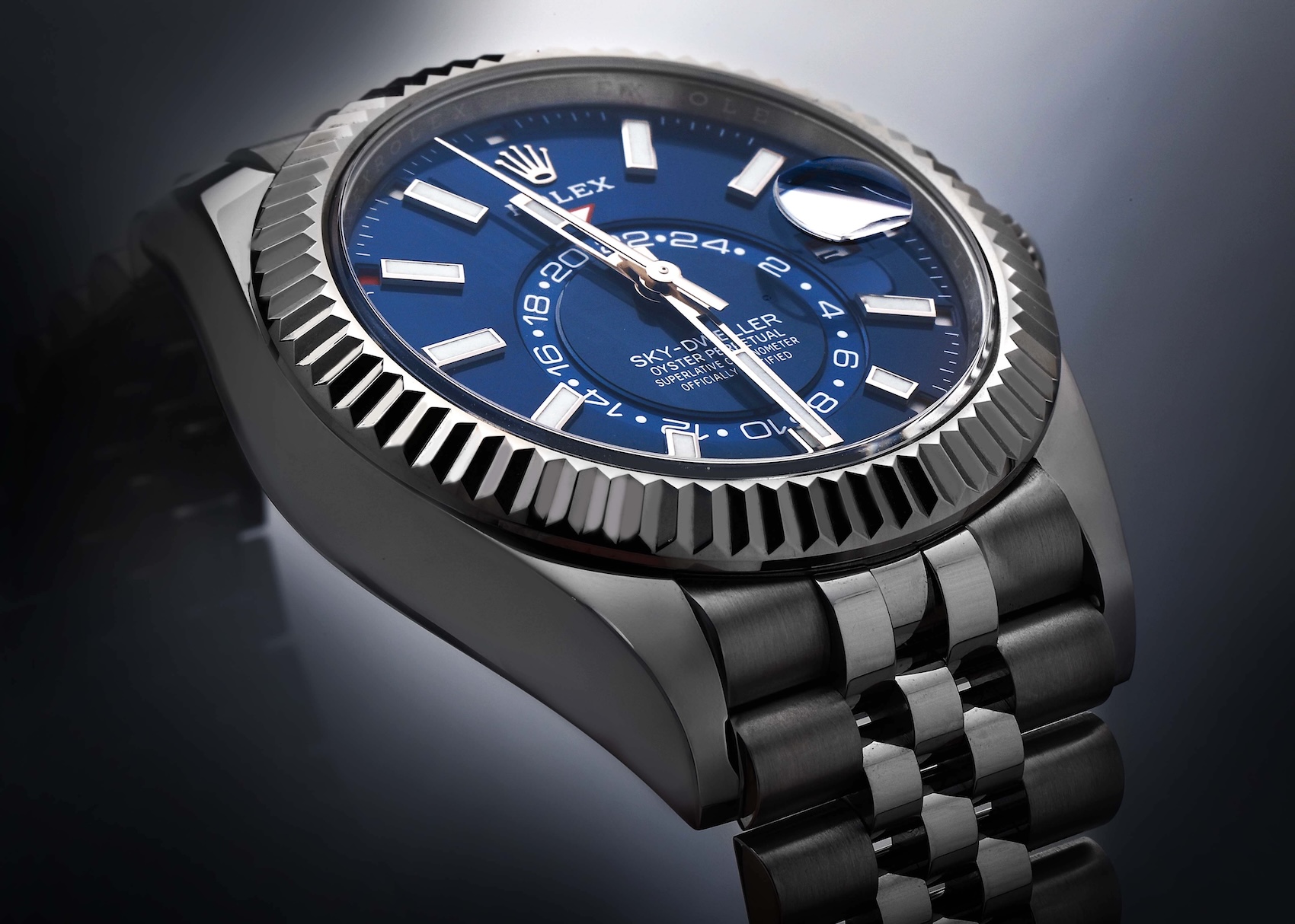 Rolex Sky-Dweller reference 326934 in steel and white gold featuring a blue dial and fluted Ring Command bezel.